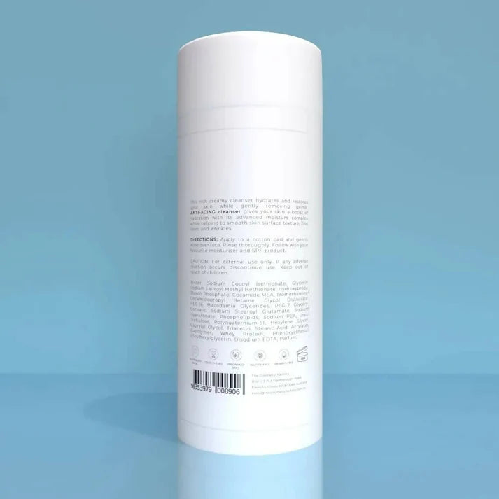a bottle of anti-aging cleanser 200ml on a blue surface.