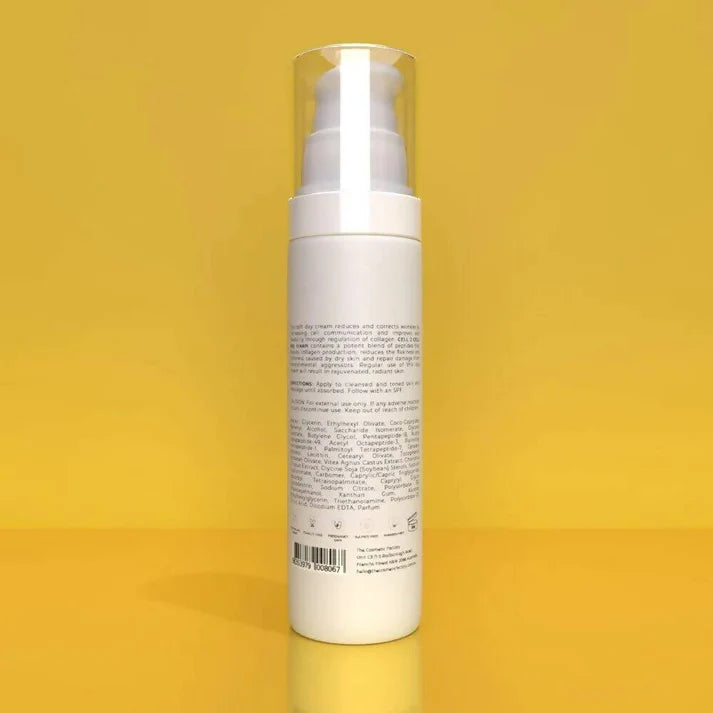 a bottle of cell 2 cell day cream 50ml on a yellow surface.