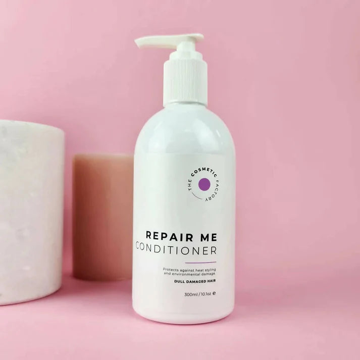 a bottle of repair me conditioner 300ml on a purple background.