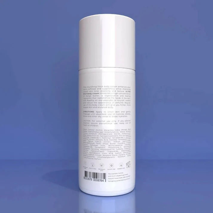 a bottle of ultra rich body cream 200ml on a blue surface.